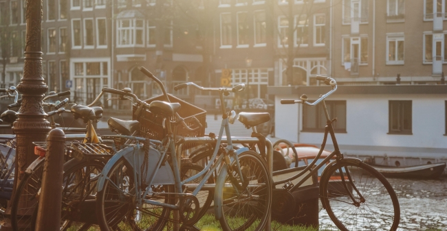 Bicycles parked near canal at amsterdam netherlan 2024 11 17 07 44 07 utc min