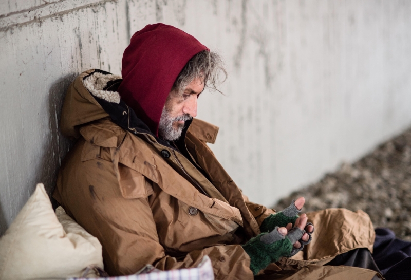 Homeless beggar man sitting outdoors in city askin 2024 10 18 08 57 41 utc min